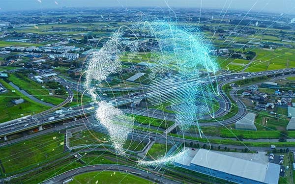 Glowing digital globe over a connected system of highways.